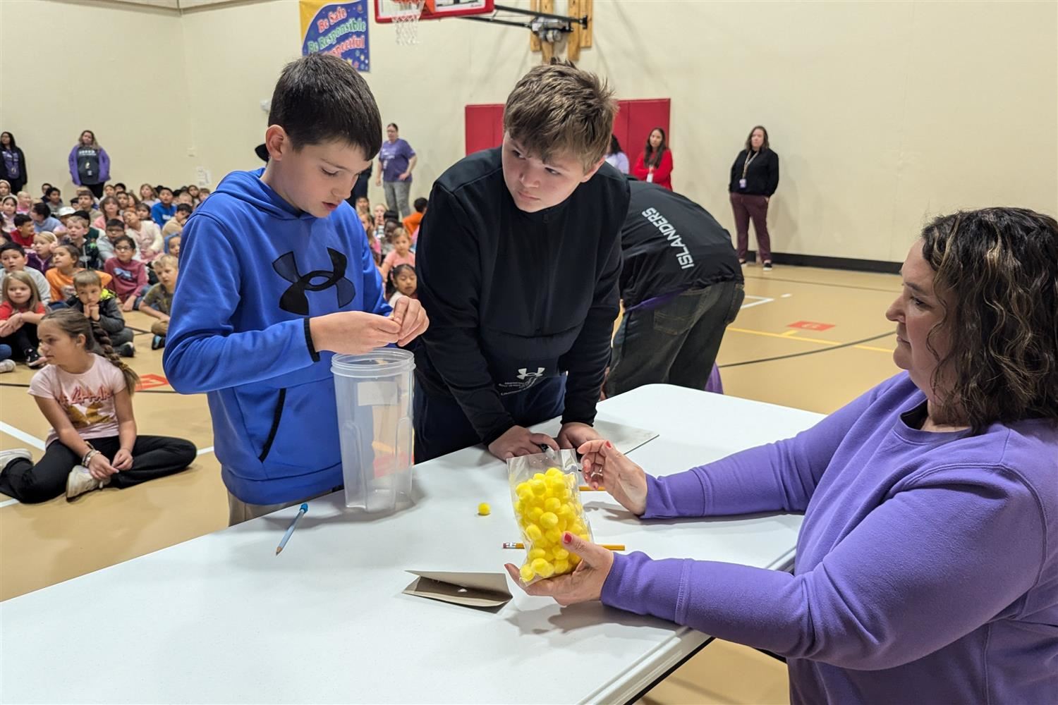 Stolley Park students playing minute-to-win-it games during an all school assembly.